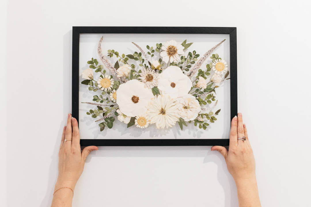 The Dainty Co_pressed flowers_pressed boquet_hands holding black framed pressed flowers